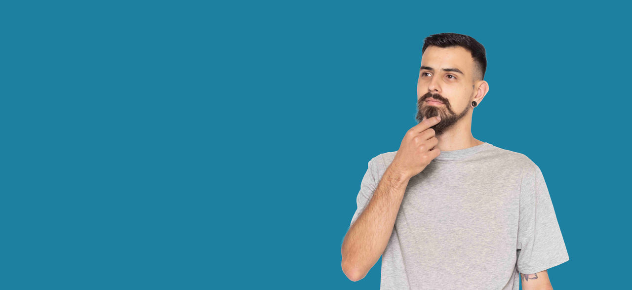 man with hand on chin